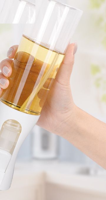Glass oil sprayer in hand